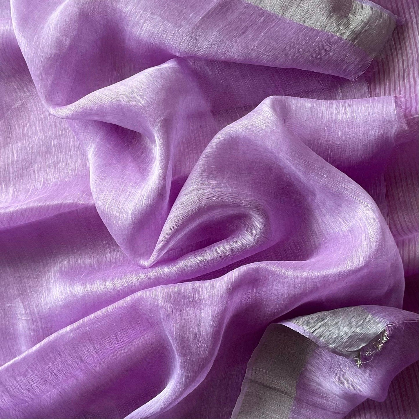 Linen Silk Lilac Saree with kota woven striped saree with silver zari borders.featuring linen plain blouse.