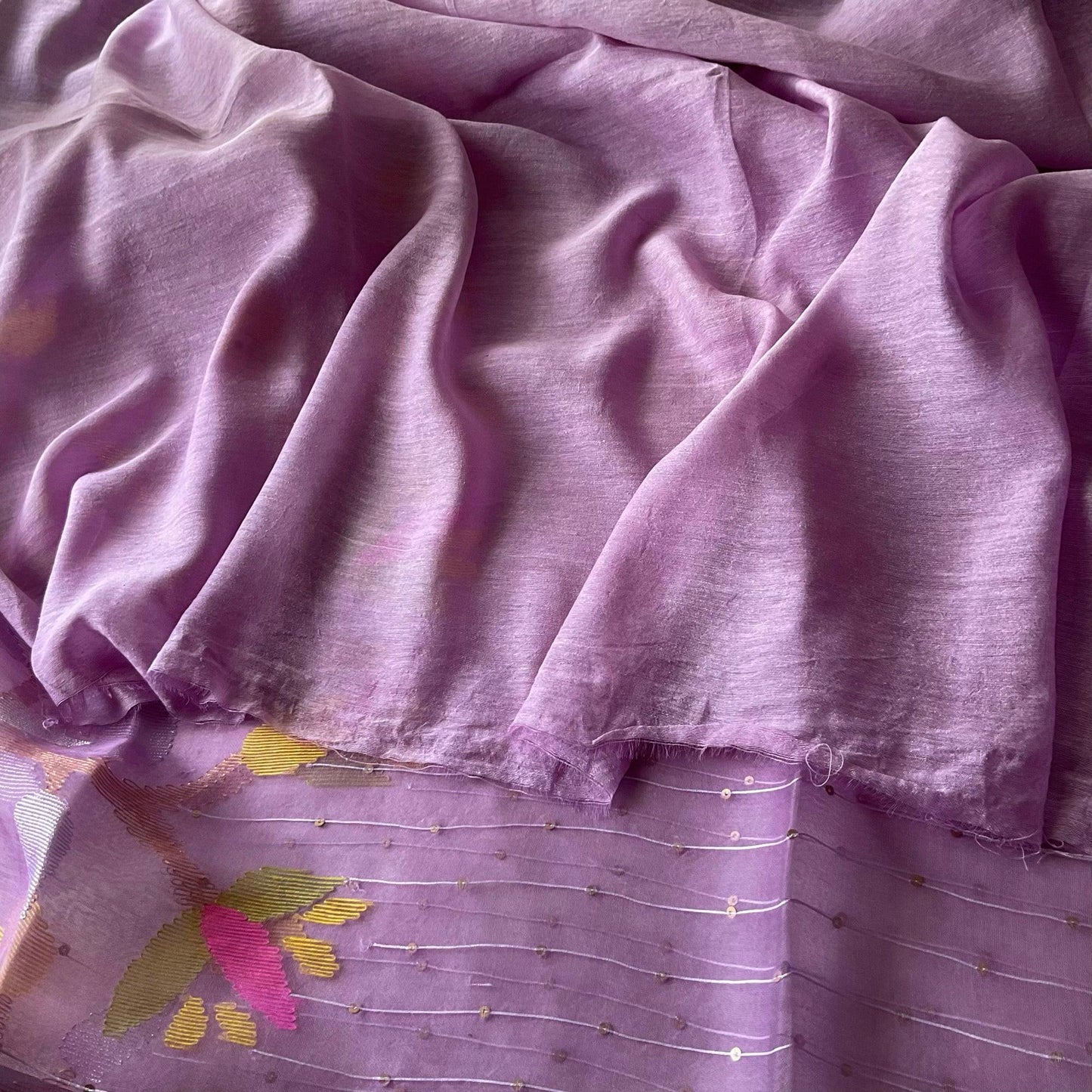 Lavender muslin silk saree with dual Jamdani borders with matching plain linen unstitched blouse fabric.