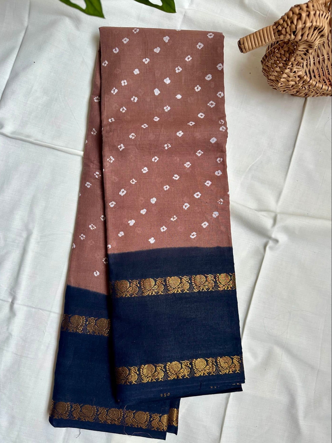 Light Brown saree with black border with Annam motif.