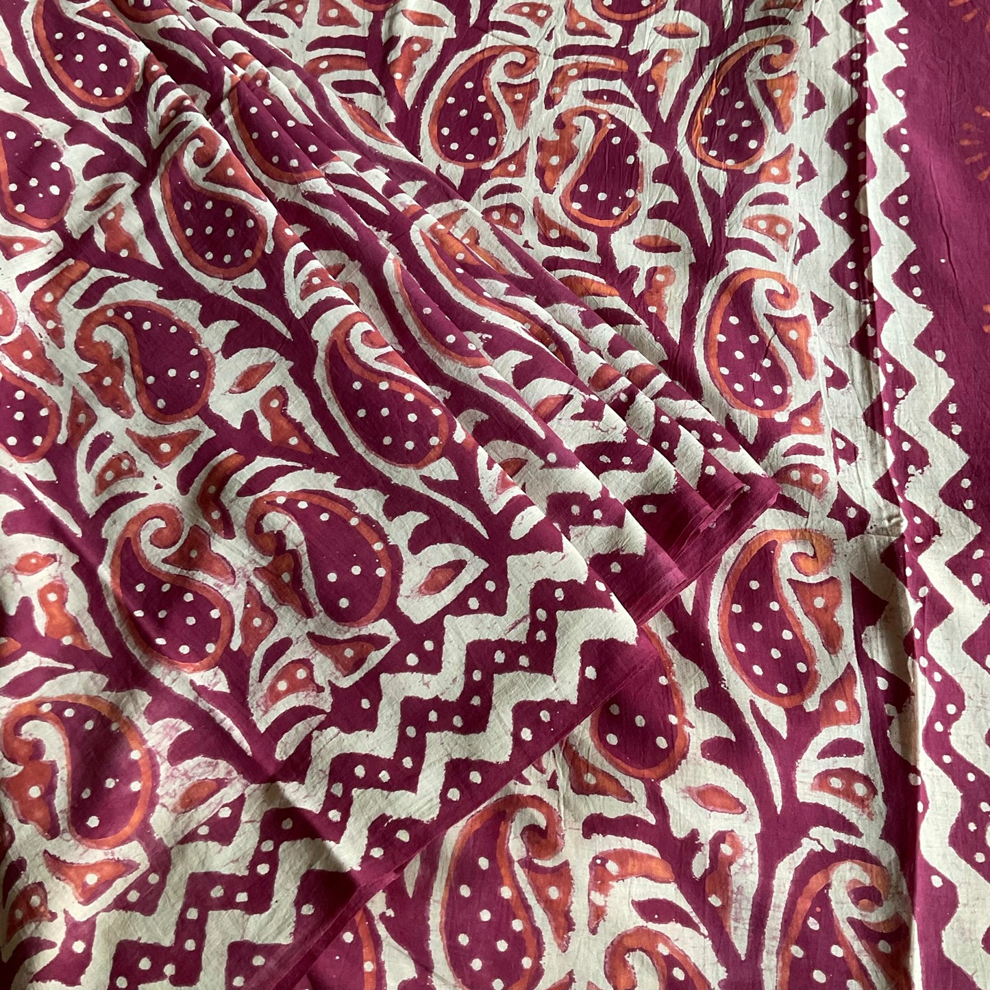 Mulmul Cotton handblock printed saree in maroon pleated close look.