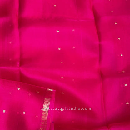 Rani pink Kora Banarasi saree opened full length showing woven buttis, Kaduva border and brocade pallu