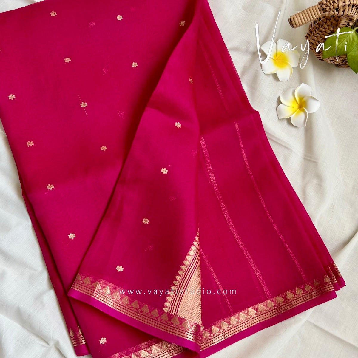 Folded rani pink Kora Banarasi saree with small woven buttis all over and Kaduva border by Vayati Studio