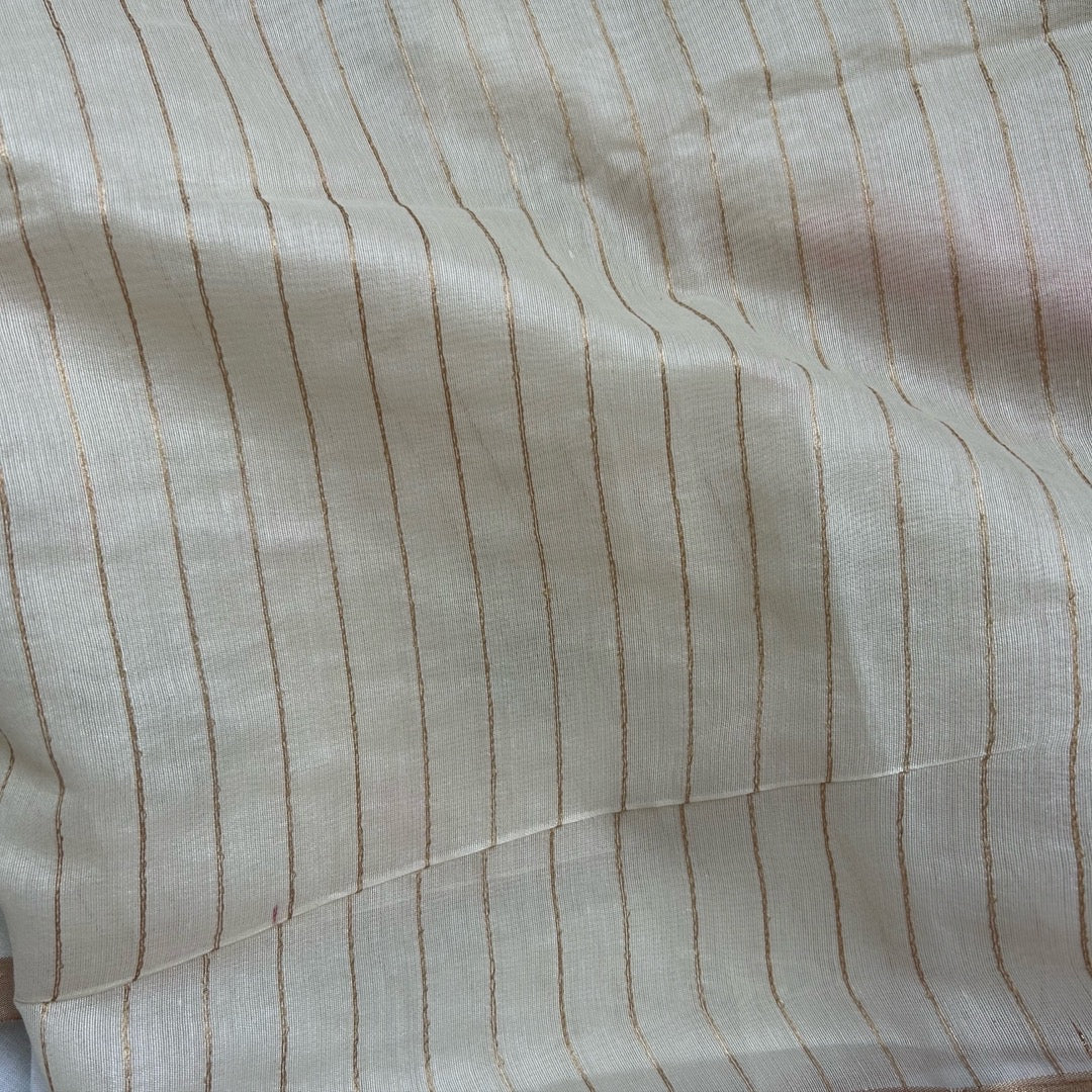 Close-up of striped blouse with thin antique stripes on a half white