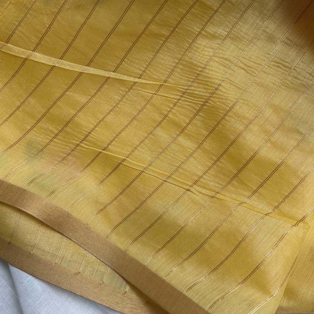 Yellow semi linen saree with jamdhani woven blouse. 