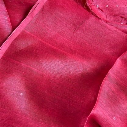 Linen silk saree, Close-up of red fabric with a textured surface